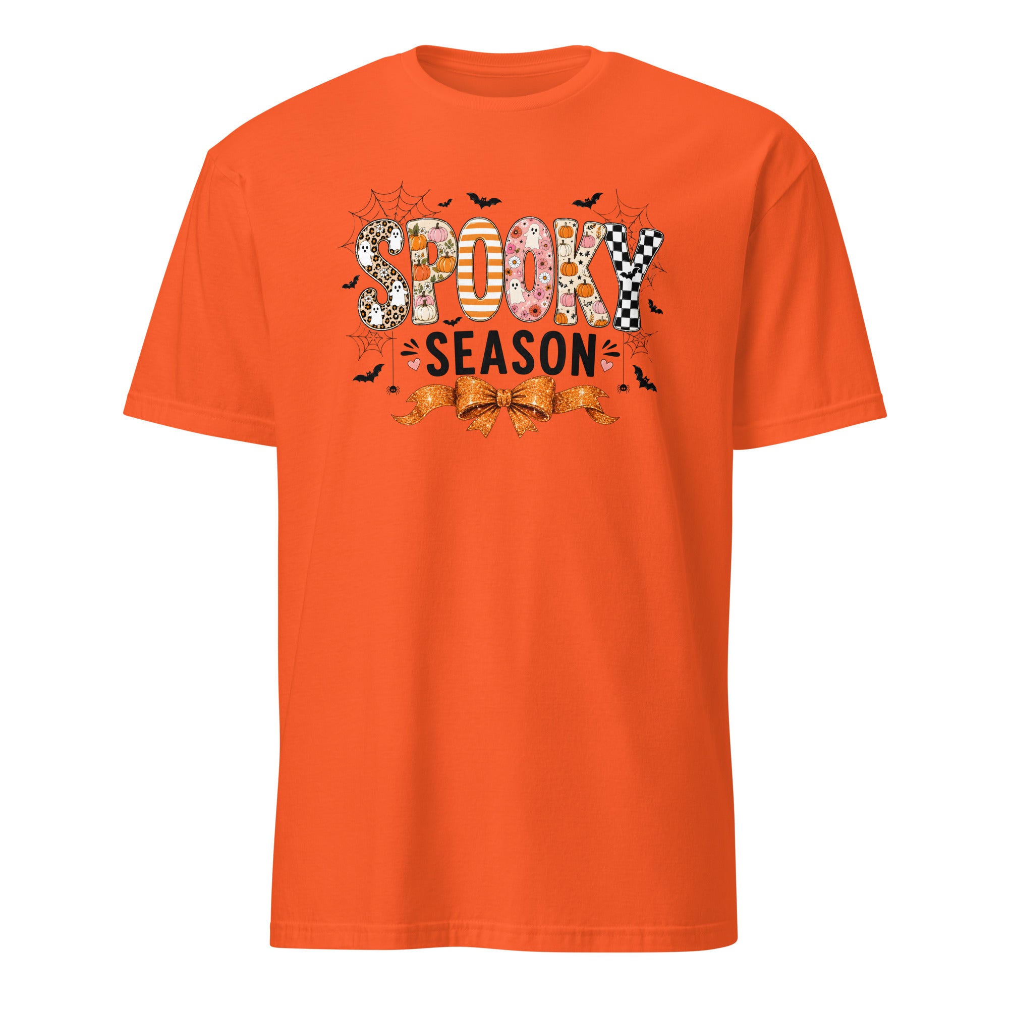 An orange short-sleeve crewneck t-shirt featuring a 'Spooky Season' graphic on the chest with Halloween-themed patterns and illustrations.