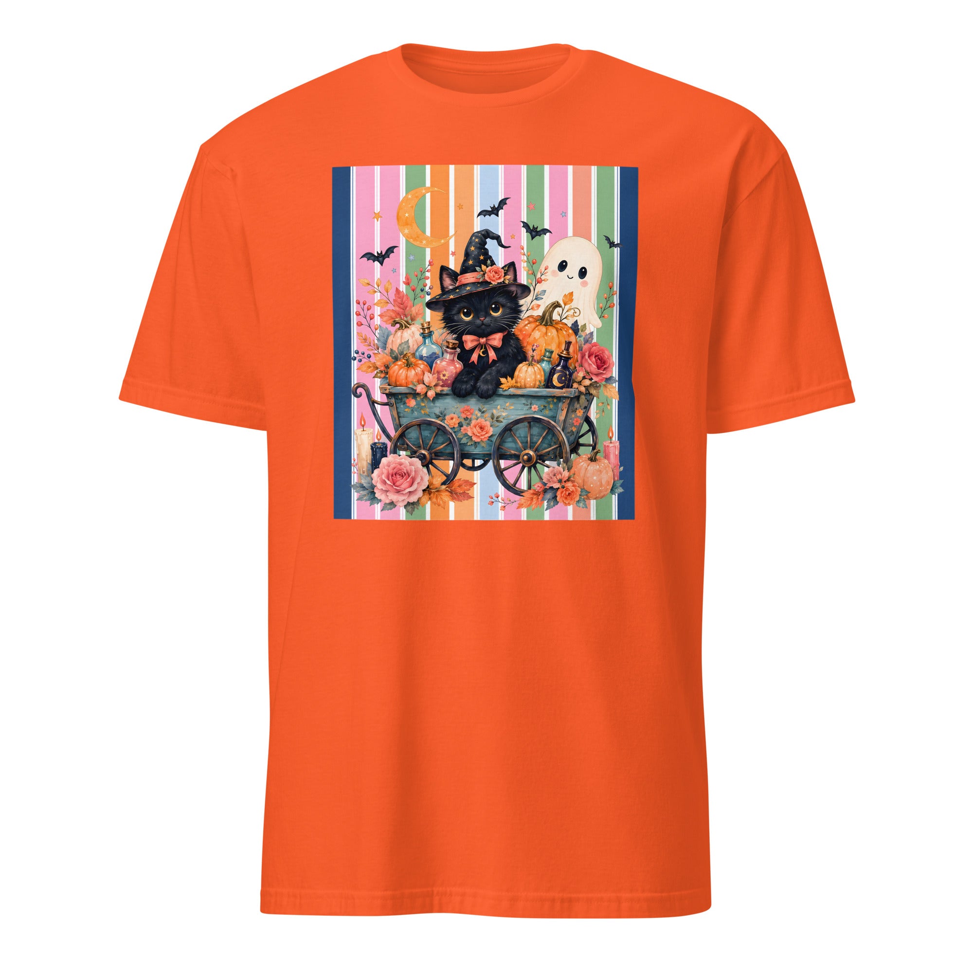 An orange short-sleeve crewneck t-shirt featuring a colorful Halloween-themed graphic print on the chest. The print depicts a black cat dressed as a witch in a cart with pumpkins, a white ghost, a moon, and bats against a striped background.