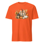 A bright orange short-sleeve crewneck t-shirt featuring a detailed autumn graphic on the chest with striped pumpkins, sunflowers, a lantern, and fall leaves.