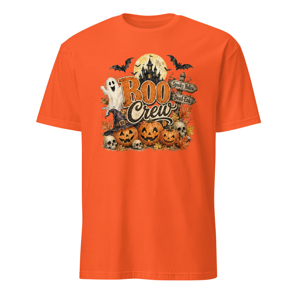 An orange short-sleeve crewneck t-shirt featuring a Halloween graphic on the chest with the text 'BOO Crew' and illustrations of jack-o'-lanterns, a ghost, a witch hat, bats, and a full moon.