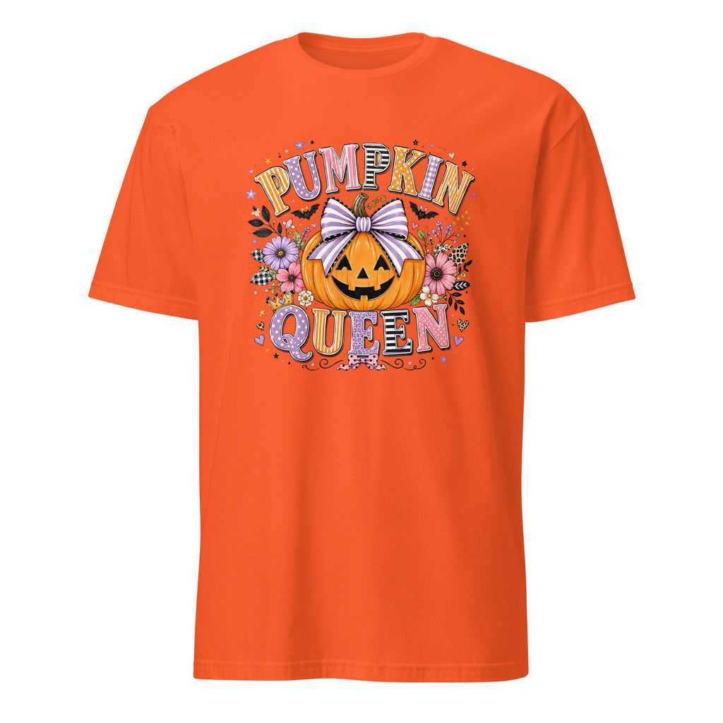 A bright orange short-sleeve crewneck t-shirt featuring a colorful graphic on the front with the text 'PUMPKIN QUEEN' surrounding a jack-o'-lantern pumpkin with a white bow and autumn flowers.