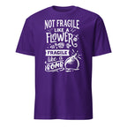Purple t-shirt with white Not Fragile Like A Flower Fragile Like A Bomb text and graphic on a white background