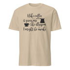 Beige t-shirt with "I Like Coffee Because It Gives Me The Illusion I Might Be Awake" text design on a white background