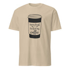 Sand t-shirt with a coffee cup graphic and "I Never Laugh Until I've Had My Coffee" text on a white background