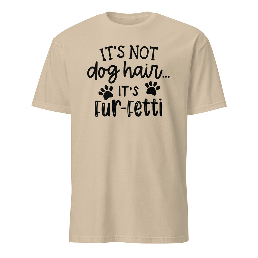 Beige t-shirt with black text and paw prints on a white background