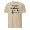 Beige t-shirt with black text and paw prints on a white background
