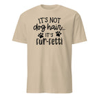 Beige t-shirt with black text and paw prints on a white background