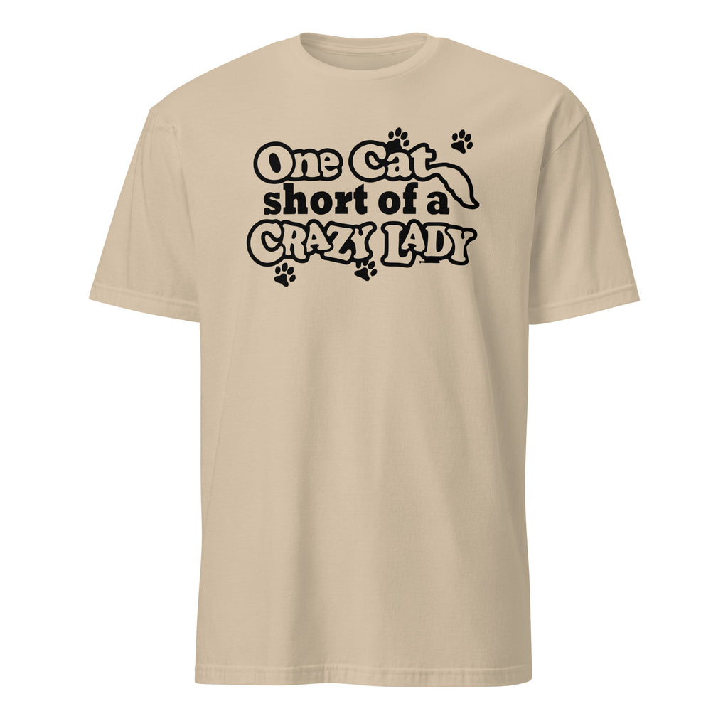 Beige t-shirt with black text 'One Cat Short of a Crazy Lady' on a white background