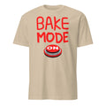 Beige t-shirt with red 'BAKE MODE ON' text and graphic on a white background