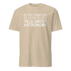 Beige t-shirt with white text 'IF YOU WANT ME TO LISTEN TO YOU, TALK ABOUT ASTRONOMY' on a white background