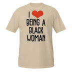 Beige t-shirt with 'I ❤️ BEING A BLACK WOMAN' text on a white background