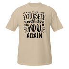 Beige t-shirt with motivational quote on a white background