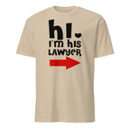 Beige t-shirt with text 'hi, I'm his lawyer' and a red arrow on a white background