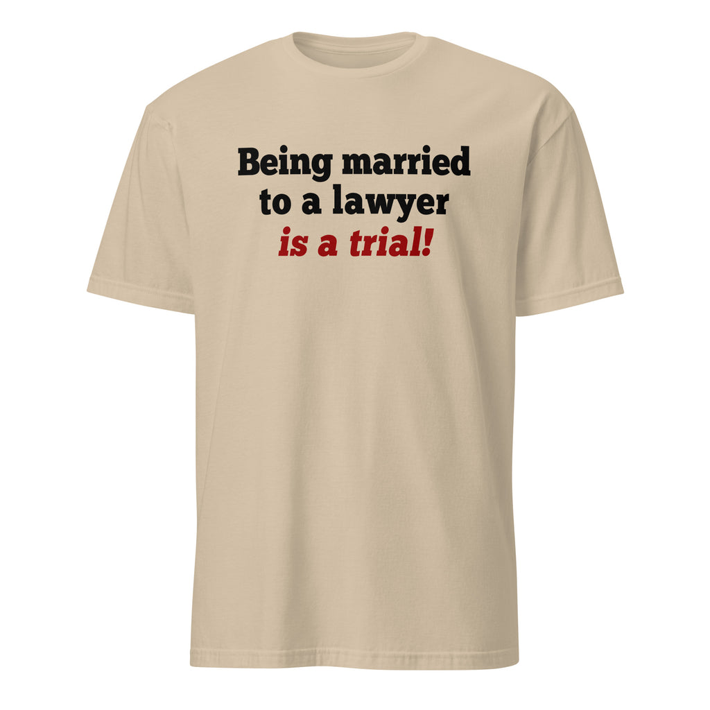 Beige t-shirt with text 'Being married to a lawyer is a trial!' on a white background