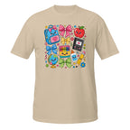A beige short-sleeve crewneck t-shirt featuring a colorful cartoon school supplies graphic on the chest, including a blue backpack, red apple, bow, globe, and pencil on a white background.