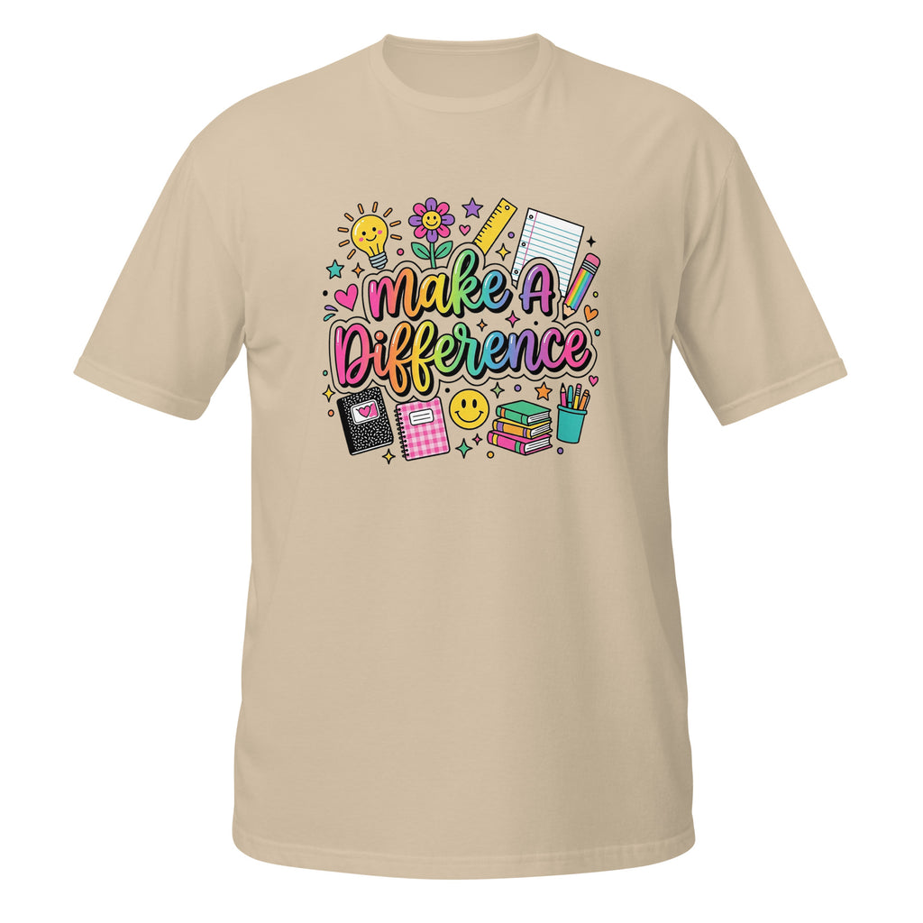 A beige short-sleeve t-shirt with a colorful graphic on the chest that reads 'Make A Difference' surrounded by school-themed doodles like a lightbulb, flowers, a ruler, a pencil, notebooks, and a smiley face.