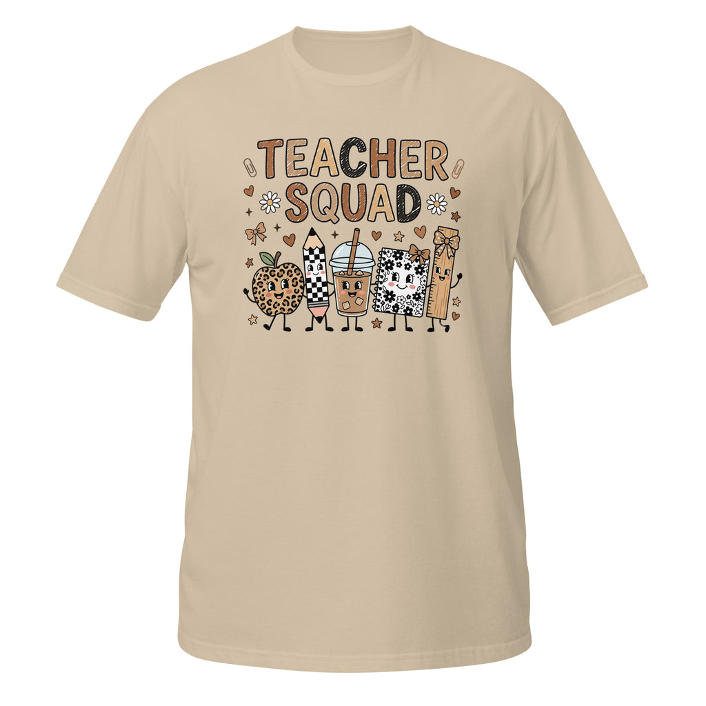 A beige short-sleeve crewneck t-shirt featuring a colorful graphic on the front that reads 'TEACHER SQUAD' above five cute cartoon characters representing school supplies and treats.
