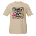 A beige short-sleeve t-shirt with a colorful graphic on the chest that reads 'Happy to see your face' in black script, surrounded by cute illustrations of a smiling pink apple, a yellow pencil, flowers, and school-themed doodles.