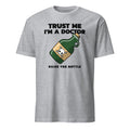 Gray t-shirt with a graphic of a bottle and text 'Trust Me I'm a Doctor Raise the Bottle' on a white background