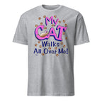 Grey t-shirt with 'My Cat Walks All Over Me!' text and paw prints on a white background