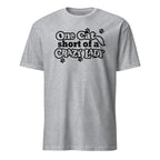 Gray t-shirt with black text 'One Cat Short of a Crazy Lady' on a white background