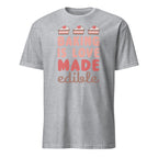 Gray t-shirt with 'Baking is Love Made Edible' text and cake illustrations on a white background