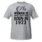 Gray t-shirt with black text 'No woman is perfect except those born in 1973' on a white background
