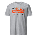 A sport grey short-sleeve crewneck t-shirt featuring a 'Happy Halloween' graphic on the chest. The graphic has 'Happy Halloween' written in white letters inside a bright orange cloud outline, with three black spiders and two black bats flying around it.