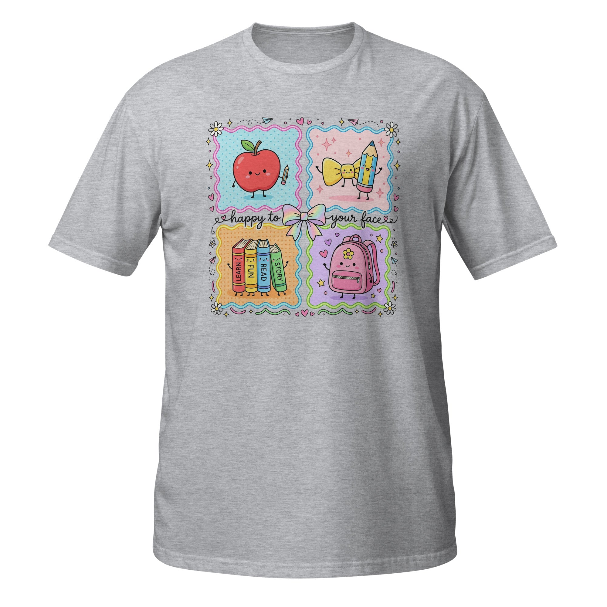 A heather gray short-sleeve t-shirt with a colorful graphic print on the front. The graphic features a four-quadrant school-themed design with a smiling red apple, a yellow bow, books, and a pink backpack, accompanied by the text 'happy to see your face!'.