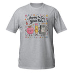 A heather gray short-sleeve t-shirt with a colorful graphic on the chest that reads 'Happy to See Your Face' above three cute cartoon characters, shown on a plain white background.