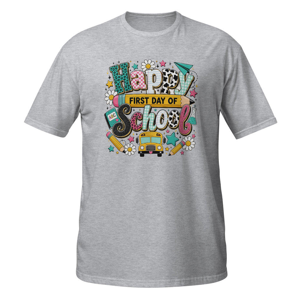 A heather gray short-sleeve t-shirt with a colorful 'Happy First Day of School' graphic on the chest, featuring school-themed doodles, a yellow school bus, and patterned lettering.