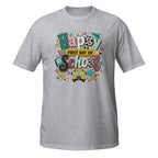 A heather gray short-sleeve t-shirt with a colorful 'Happy First Day of School' graphic on the chest, featuring school-themed doodles, a yellow school bus, and patterned lettering.